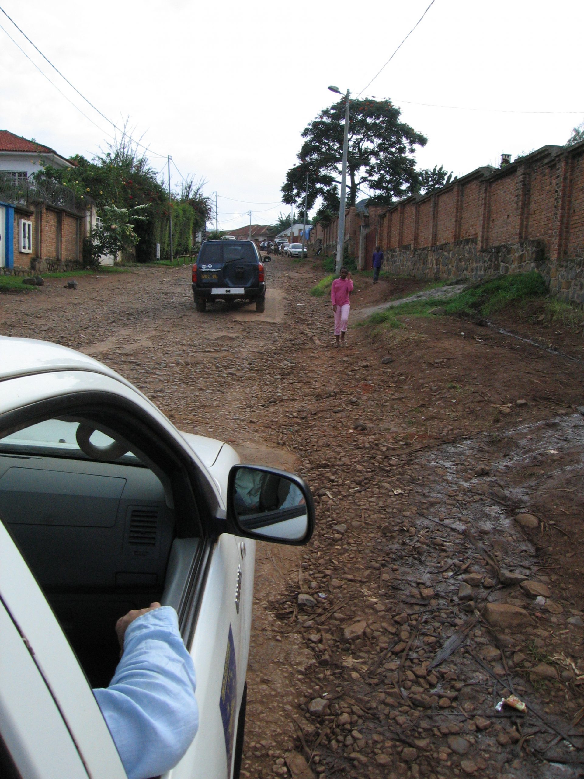 Vehicle travelling on dirt road in Eastern DRC.